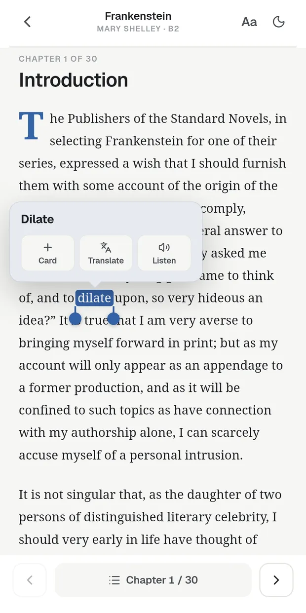 The reader open on a page of Frankenstein with a word selected and its Card / Translate / Listen menu showing